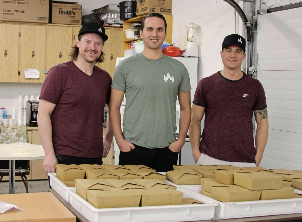 Photo by Sydney Hildebrandt
(From left) Jeff Johnson, Benjamin Nasberg, and Jessie McDougall delivered 60 warm meals to Sscope on April 27.