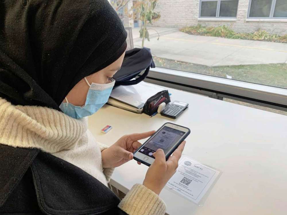 Sou'wester
A student scanning a QR code at Fort Richmond Collegiate.