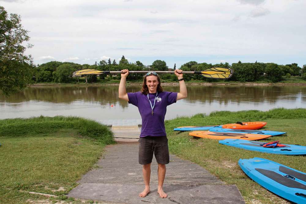 Sou'wester
Summer camp counsellor Florian Haskerkehrer demonstrates the technique for sizing a kayak paddle at the Manitoba Canoe and Kayak Centre.