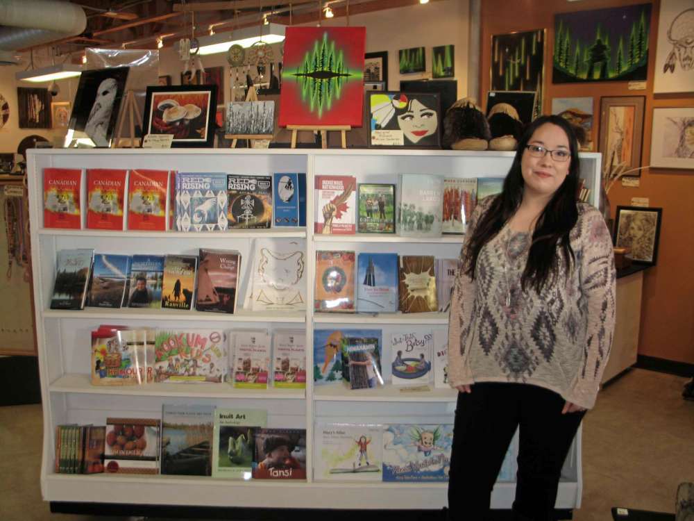 Tony Zerucha
Jade McIvor poses with a selection of books available at Neechi Niche