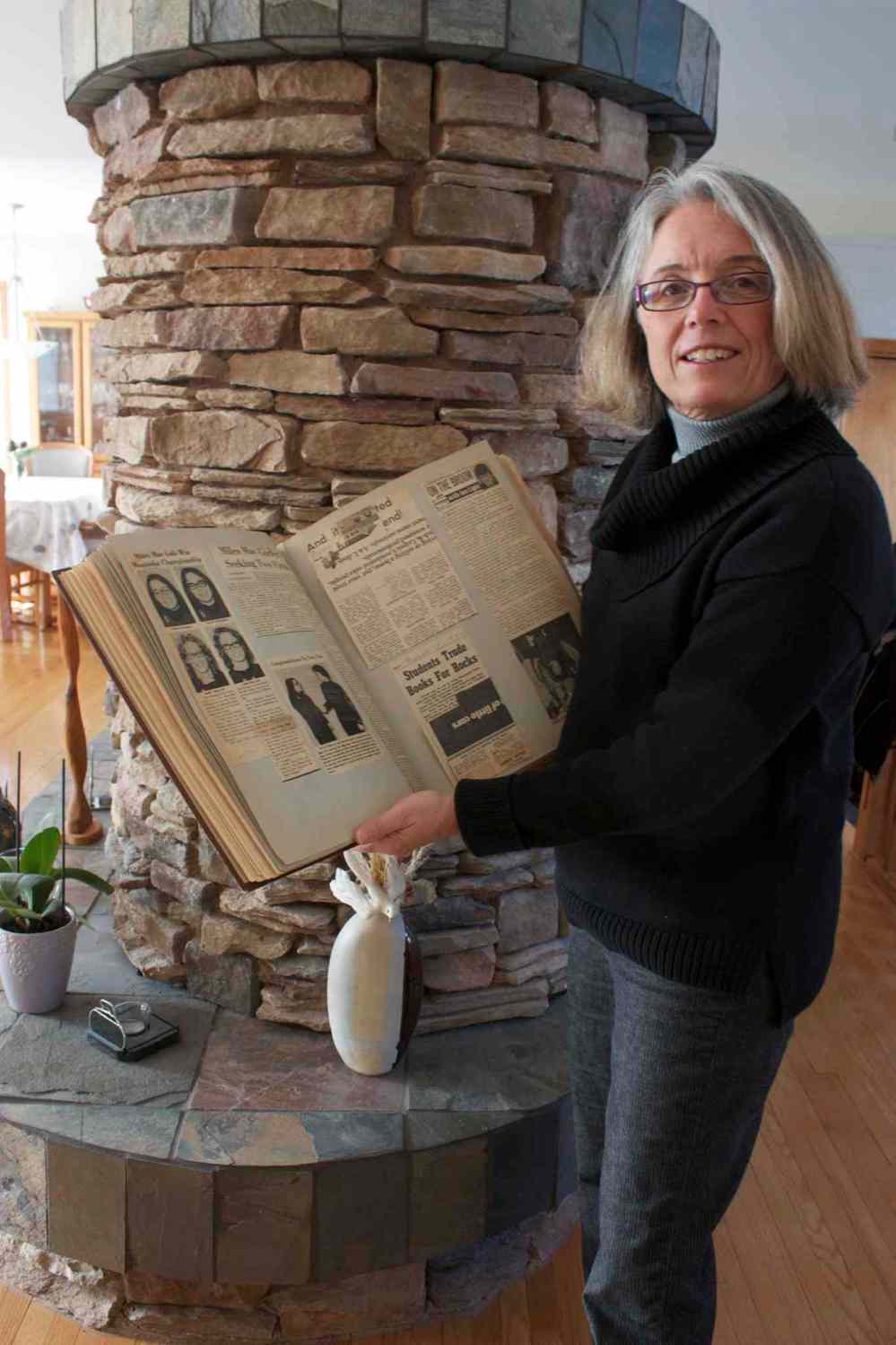 Photo by Dan Falloon
Former Miles Macdonell curler Chris Scalena is shown with a scrapbook of memorabilia of her 1972 provincial champion rink.