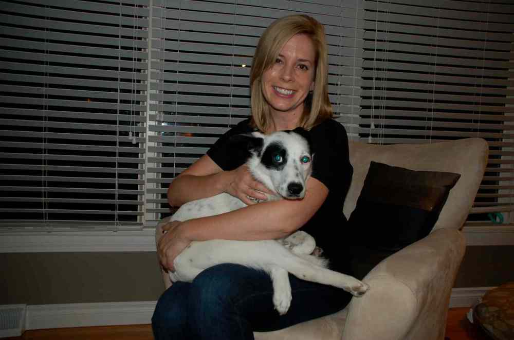 Photo by Dan Falloon
East Kildonan resident Kareena Grywinski holds rescue dog Hope at her home.