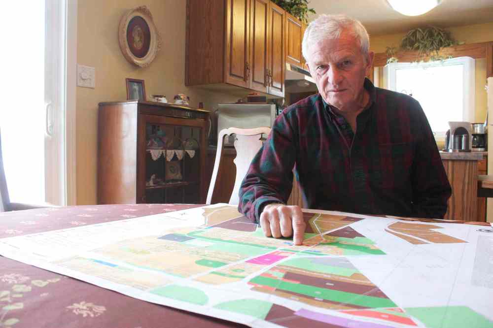 Photo by Dan Falloon
East St. Paul resident Brian Duval is shown with a zoning map of the entire rural municipality. Duval is heading up a group of residents fighting to prevent council from allowing 8,000-square-foot lot sizes.