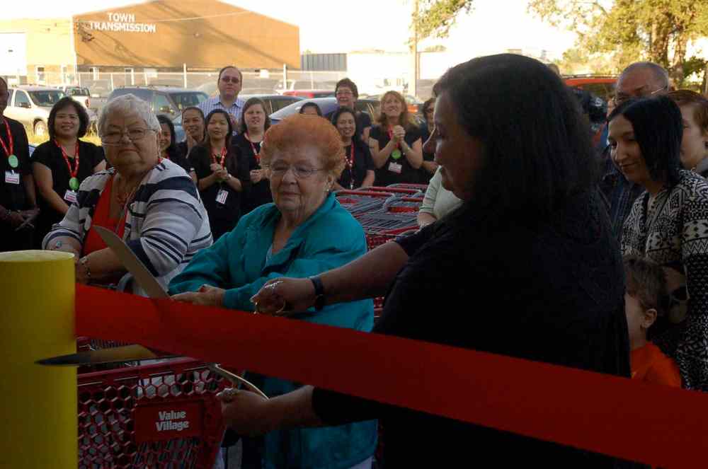 Photo by Dan Falloon
Value Village Nairn Avenue store manager Sherri Hill cuts the ribbon officially opening the relocated location on Aug. 28 as eager shoppers look on.