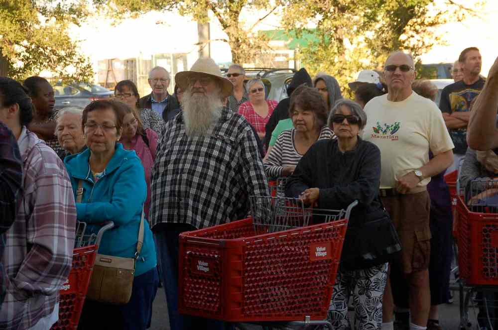 Photo by Dan Falloon
Thrift shoppers eagerly anticipate the opening of the relocated Value Village location at 970 Nairn Ave. on Aug. 28.