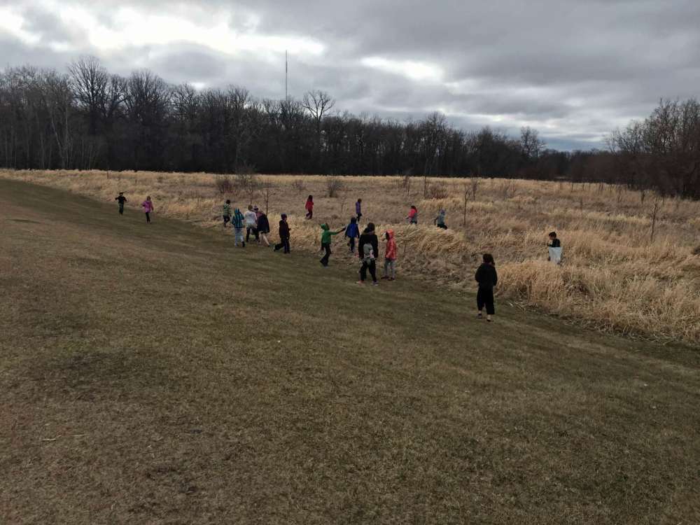 Supplied photo
Students at École St. Norbert Immersion took the initiative on April 27 and headed out into the community armed with garbage bags and gloves to help clean up trash revealed by the winter melt.