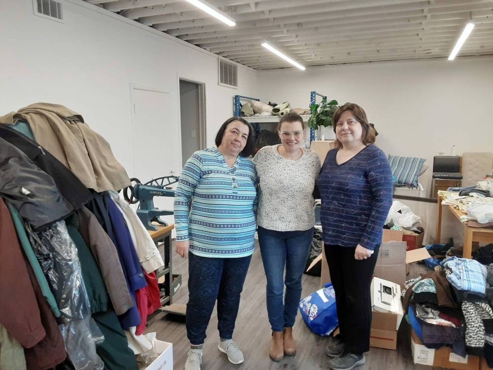 Photo by Jarrett King
                                (From left) Tetiana Sydorova, Candice Desjardins and Luda Shevchuk have helped hundreds of Ukrainians with everything from jobs and apartments to resumes, clothes and housewares.