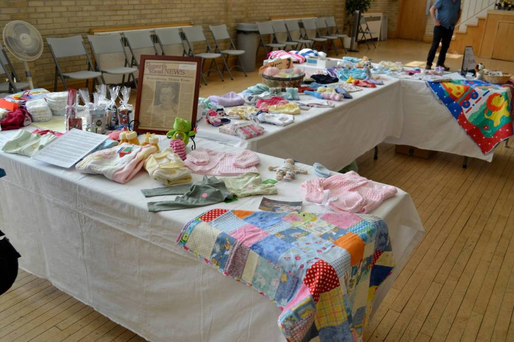 Photo by John Kendle
Some of the layettes and newborn baby items on display at the ‘shower’ held by organizers of the Thelma Wynne Project.