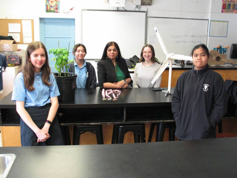 File photo by Simon Fuller
From left: Holy Cross students Stephanie Christle and Jailley Marcelino, Bison Regional Science Fair founder and chair Dr. Anju Bajaj, former Holy Cross student Grace Madden, and Holy Cross student Wynona Teologo are pictured in this 2021 file photo prior to last year’s fair.
