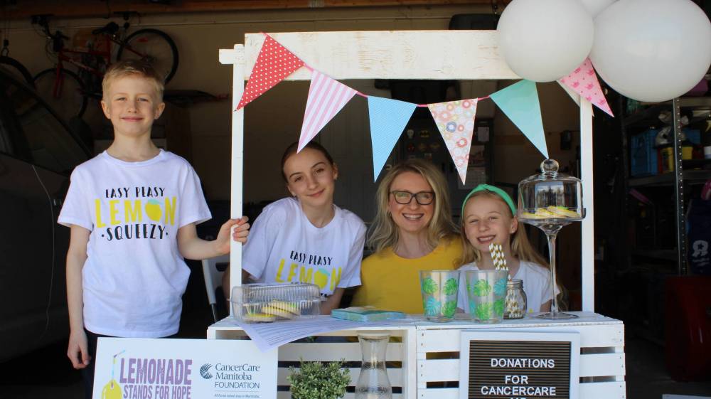 Supplied photo
A family from the Lemonade Stands for Hope fundraiser’s first year poses with their own lemonade stand.