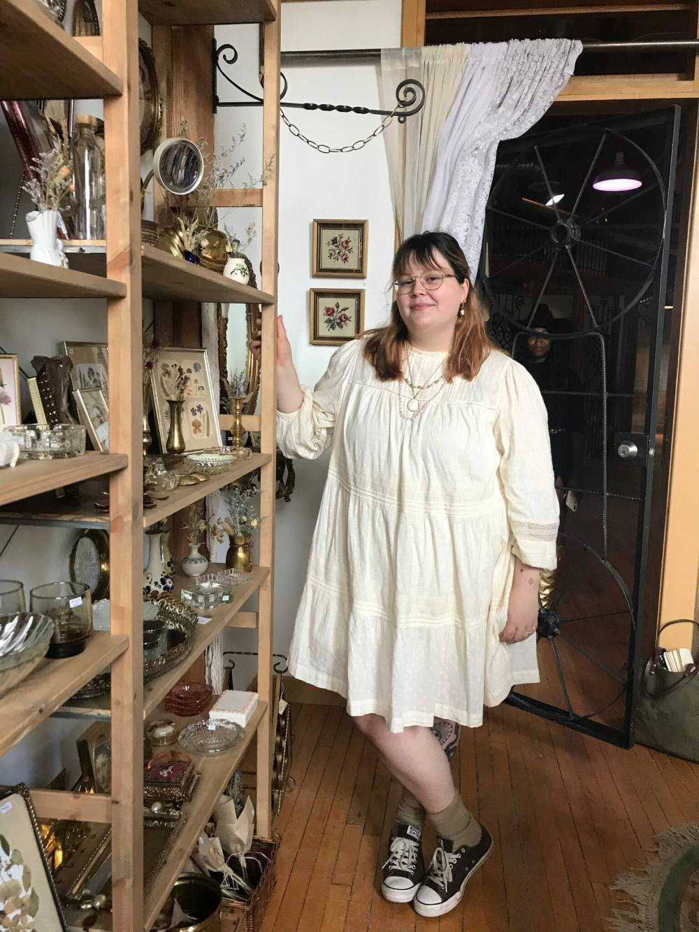 Photo by Anne Hawe
Serena Komonko poses among her wares at Golden Petal Goods, which recently moved into ARTlington Studios.