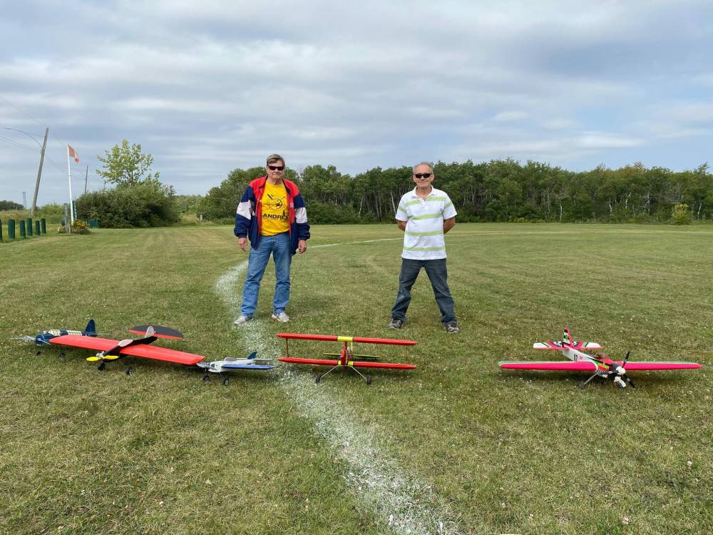 Photo by Sheldon Birnie
Perfect Circle Flying Club president Larry Maltman (left) and longtime member Kevin King are control line model plain enthusiasts who meet regularly at the club’s field at Kilcona Park to fly planes. The club has made a number of improvements to its parcel of land at Kilcona Park, which is located just off Springfield Road.