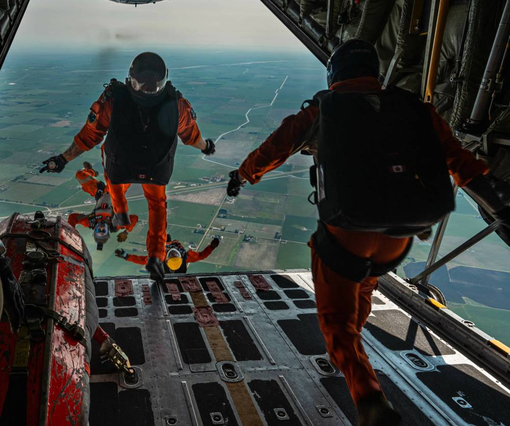 Photos supplied by RCAF
TOP: RCAF search-and-rescue techs leap from a Hercules aircraft during a 2023 training exercise.
BOTTOM: RCAF search-and-rescue techs will parachute into Assiniboine Park on the morning of April 2.
