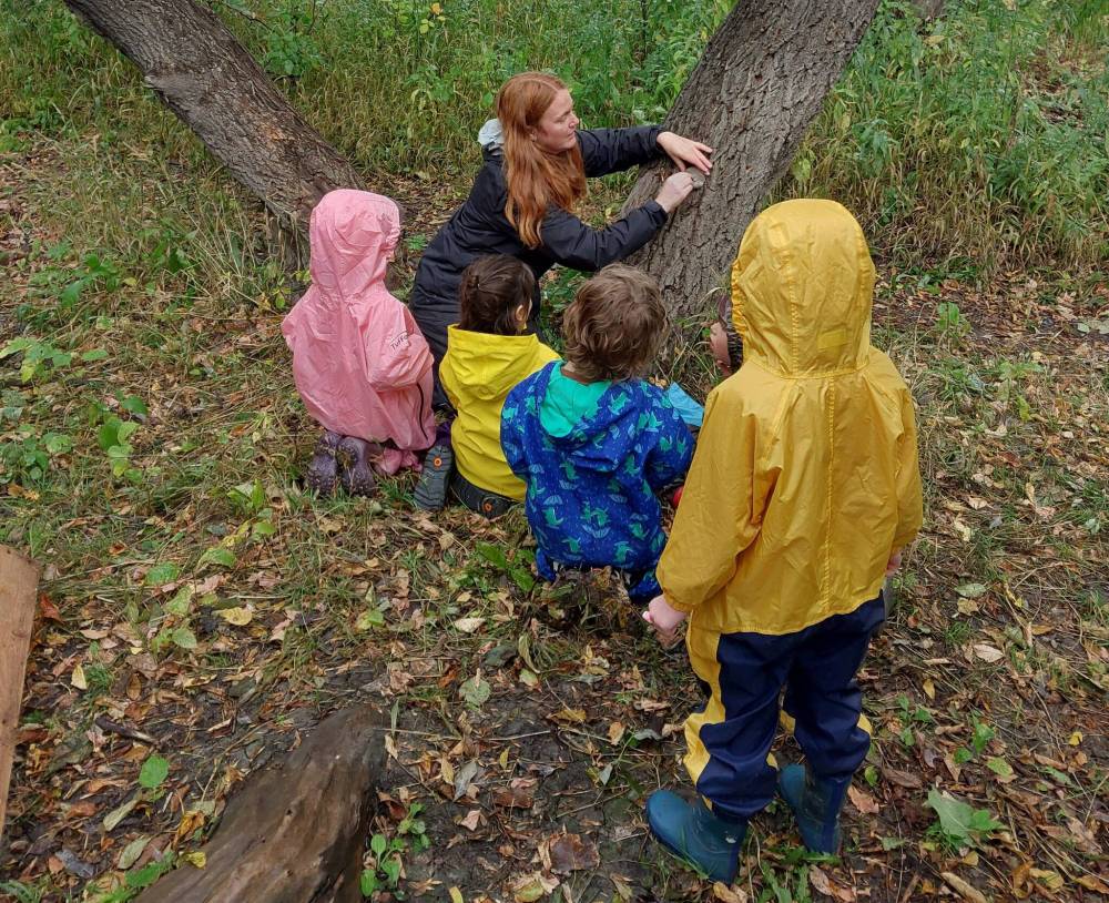 Supplied photo
Esther McNairnay, director of Riverview Ashland Child Care Centre’s new forest nursery program, is pictured with some children from the program in the woods between Churchill Drive and the Red River, where the program runs Monday to Friday.
