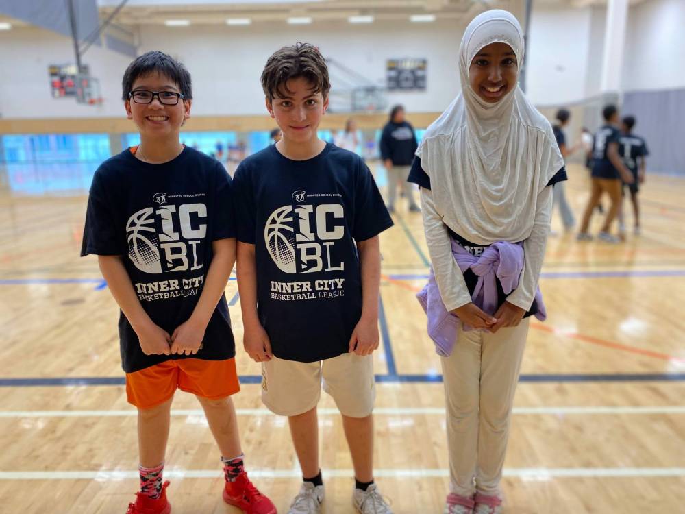 Photo by Sheldon Birnie
(From left) Khoi Tran, Ahmad Karimalddin, and Asho Muhamud are Grade 6 students at École Victoria-Albert School who are playing in the Winnipeg School Division’s new Inner City Basketball League. In the league’s inaugural season, which opened in February, 20 schools will play through the end of March.