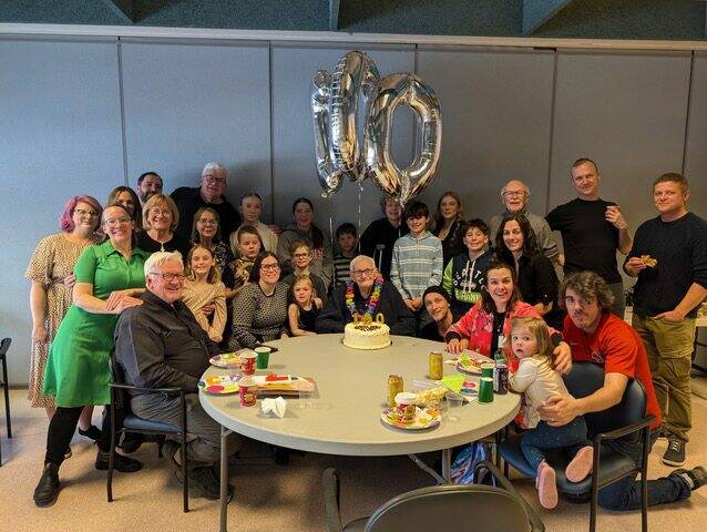Supplied photo
Joseph de Pape (centre) celebrated his 100th birthday with friends and family at Actionmarguerite on March 9. On March 10, his birthday, a mass was held in his honour.