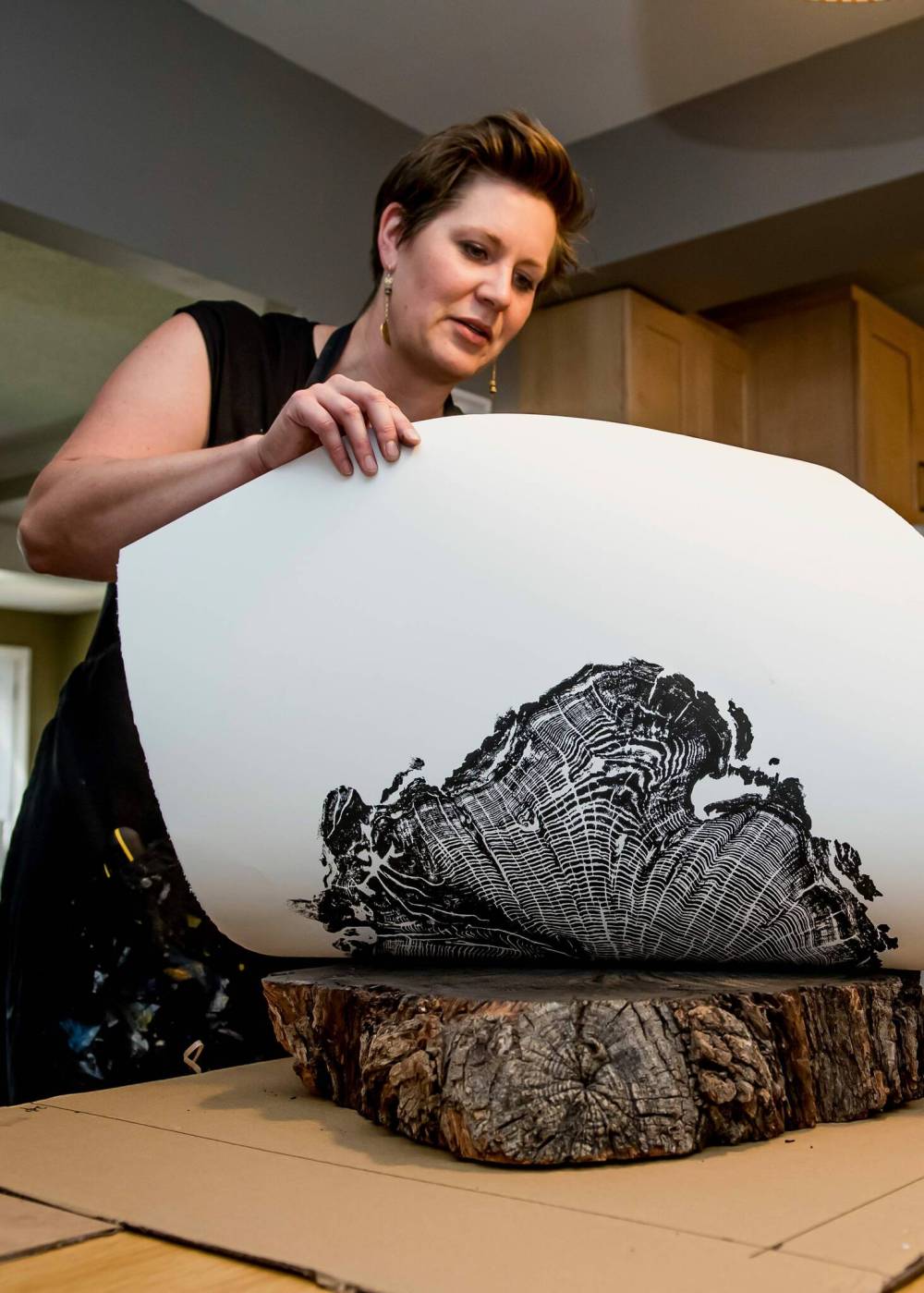 Supplied photo
Pam Gerbrandt, a Charleswood-based artist, pulling an oak print. Her practice, Nice Art People, makes hand prints from the rings of dead trees.