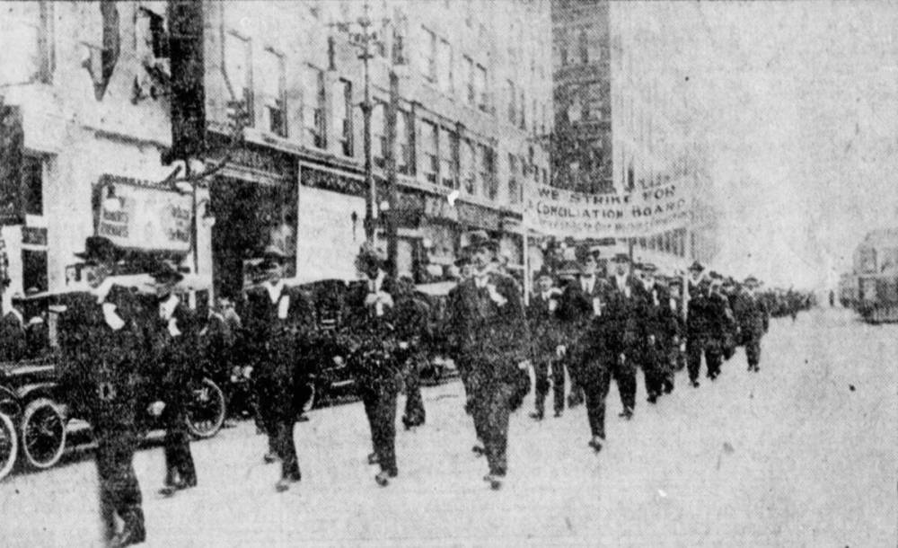 In this photo published in the Winnipeg Tribune, striking postal workers march down Main Street to a rally at the Industrial Bureau building on Friday, July 26, 1918.