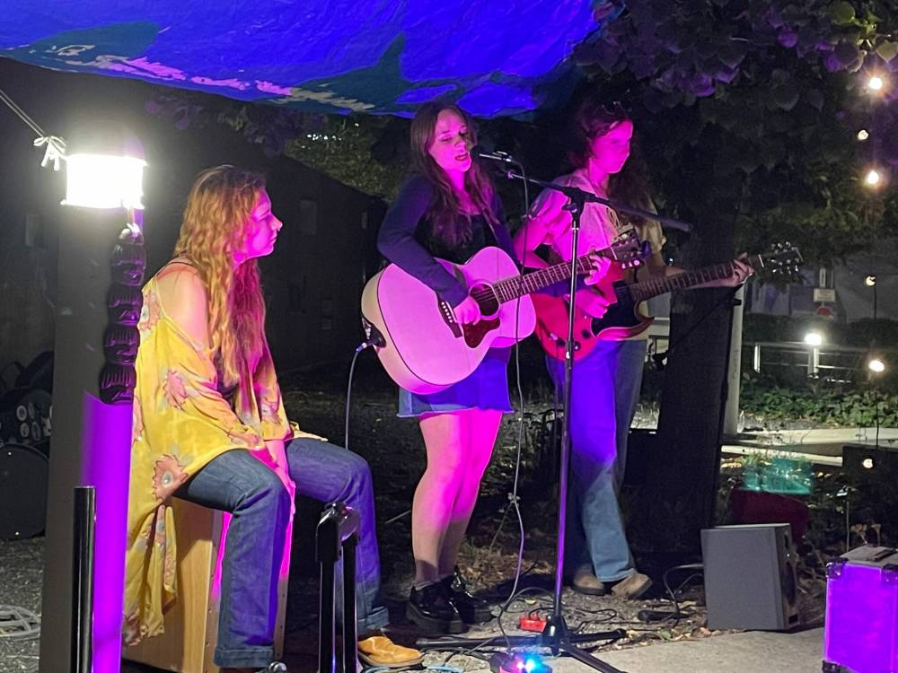 Photo by Doug Kretchmer
Prairie Smoke unleash their songs as guest host/ featured performers at CaRaVaN Open Mic on Sept. 15 at Millennium Library courtyard.