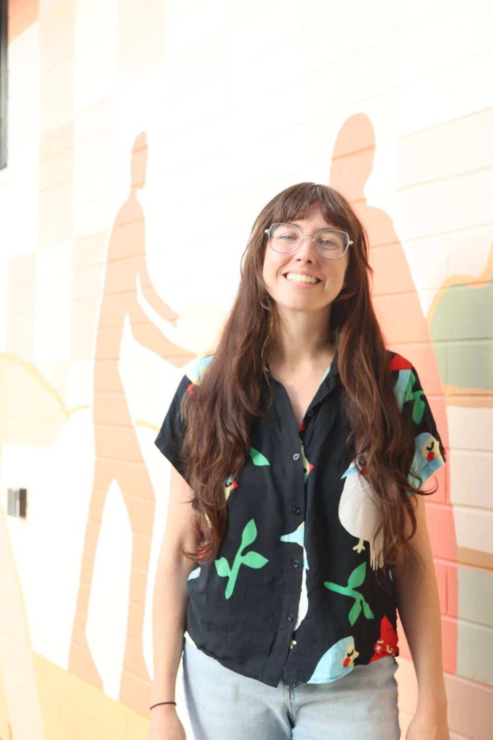 Photo by Emma Honeybun
Mae Desmond (pictured), is the artist behind a new mural on the wall of Prairie Spirit United Church, located at 207 Thompson Dr.