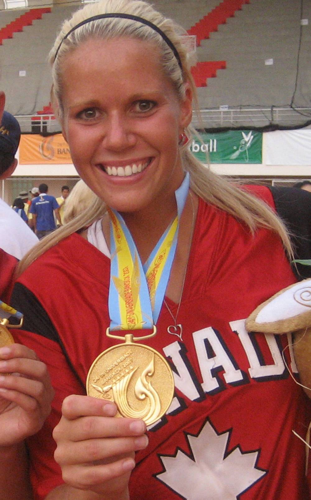 Supplied photo
Manitoba Sports Hall of Fame inductee Ashley Lanz, a dominant softball pitcher, shows off the gold medal she won playing for Canada at the 2007 FISU Games in Bangkok, Thailand.