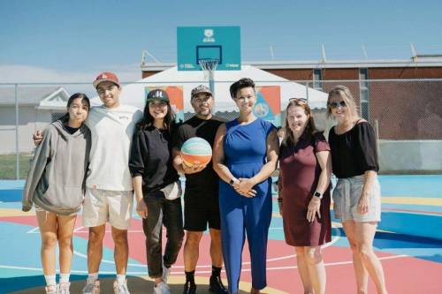 Artist Jonato Dalayoan (fourth from left), who designed the mural on the new basketball court at Northwood C.C. is pictured at the court in August with (from left) Nova Dalayoan, Josiah Dalayoan, Marie Miller-Dalayoan, Coun. Vivian Santos, Lora Meseman (General Council of Winnipeg Community Centres executive director, and Michelle Cooke (Northwood C.C. manager).