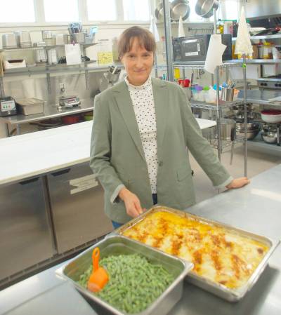 Photo by John Kendle
                                Melanie Rushton, owner/operator of Food for Thought, is pictured in the kitchen of her popular catering business.