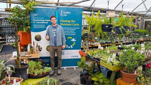 Supplied photo
                                Alec Massé is pictured with a Typha Co. display at Sage Garden Greenhouses.