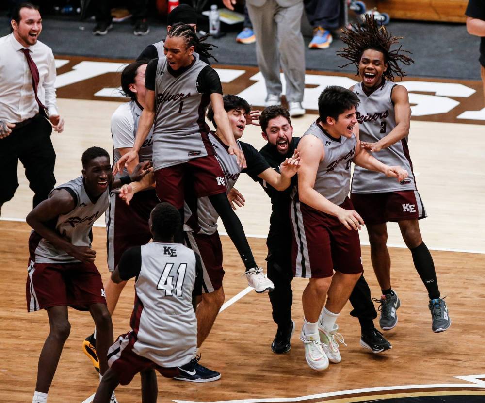 File photo by John Woods
                                Kildonan-East Reivers celebrate a win over the Dakota Lancers in the Manitoba High School 2025 AAAA Provincial Basketball Championship at the University of Manitoba on March 24, 2025.
