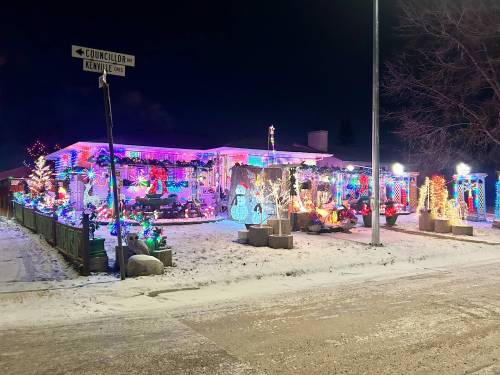 Photo by Derek Dabee
                                The &lsquo;Christmas house&rsquo; in the Maples attracts plenty of traffic during the holiday season.