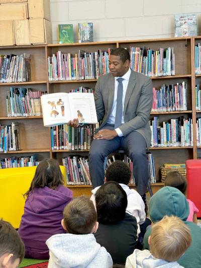 Supplied photo
                                St. Vital MLA Jamie Moses is pictured reading to Hastings School students during I Love to Read month.