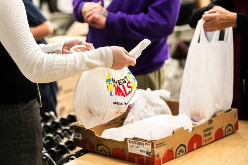 Free Press file photo
                                Students and adult volunteers pack Meals2Go at Harvest Manitoba.