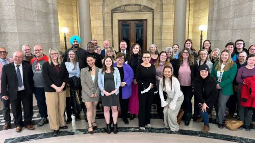 Supplied photo
                                Tyndall Park MLA Cindy Lamoureux (centre left, in blue cardigan) supporters and fellow MLAs were pleased to see the Autism Strategy Act pass second reading on March 19.