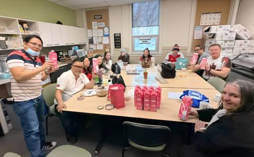 Supplied photo
                                Notre Dame volunteers preparing food donations for the community.