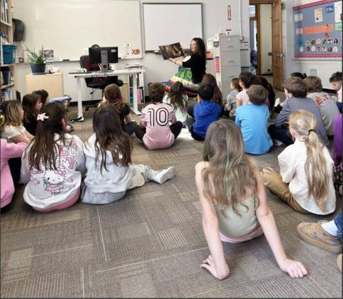 Supplied photo
                                Tuxedo MLA Carla Compton reads to the kids at École Tuxedo Park School.