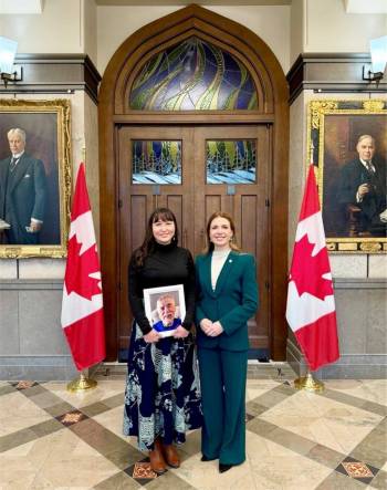 Supplied photo
                                Raquel Dancho and Britt Moberg are pictured in Parliament with a photo of Earl Moberg, Britt&rsquo;s father.
