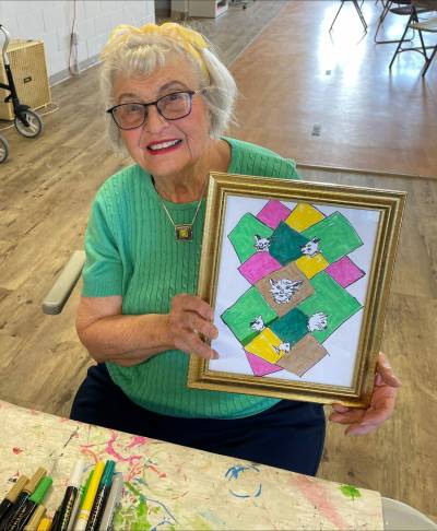 Supplied photo
                                Community correspondent Freda Glow displays her recent art project. Most assisted living residences offer popular creative craft programs for seniors.