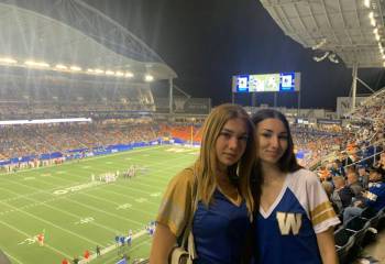 Supplied photo
                                Homestay students Sofia and Fernanda are pictured at a Winnipeg Blue Bombers game.