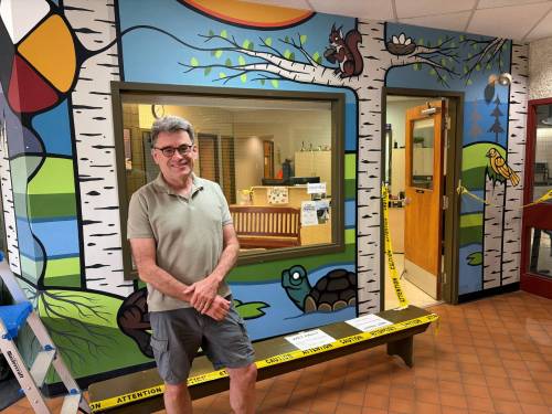 Supplied photo
                                Coun. Brian Mayes (St. Vital) in front of the new Indigenous-themed entrance mural at Darwin School to welcome students, families, and visitors