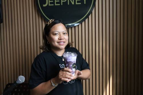 Photo by Rylee Gerrard
                                Chantilly Guerrero-Agustin, general manager of Jeepney, holding their winning entry, the ube cheese smoothie.
