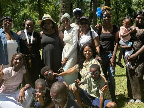 Supplied photo
                                A group photo with Zita Somakoko (centre, kneeling) at the 2025 Multiculturalism Day, hosted by the Black-Manitobans Chamber of Commerce.