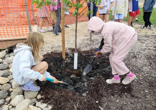 Supplied photo
                                Two students are pictured at École Howden on June 19, when a working group planted 15 trees at the Windsor Park-based school and held a small tree planting ceremony.
