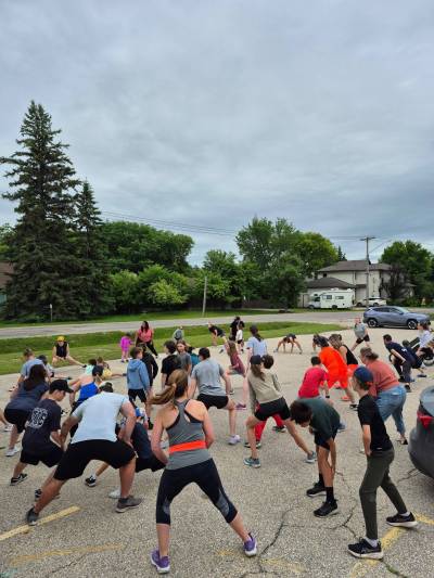 Supplied photo by Paul Ouellette
                                Runners are pictured warming up before a recent Roblin Park Running Club session.