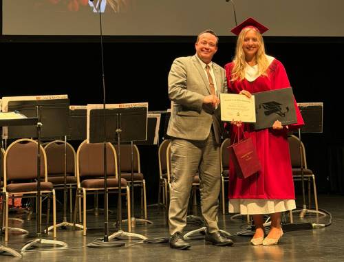 Supplied photo
                                Kirkfield Park MLA Logan Oxenham is pictured here presenting the Activism in the Arts Scholarship to 2026 Westwood Graduate, Isabel McGregor, in June.