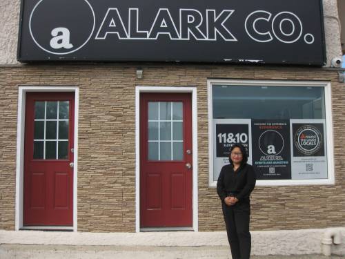 Photo by Rylee Gerrard
                                Lou Alarkon pictured here in front of her marketing and events firm located in the North End that specializes in local projects.