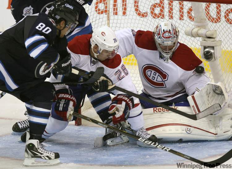 Joe Bryksa / Winnipeg Free Press
Nik Antropov scores the first NHL goal for the new Winnipeg Jets against Montreal goaltender Carey Price.