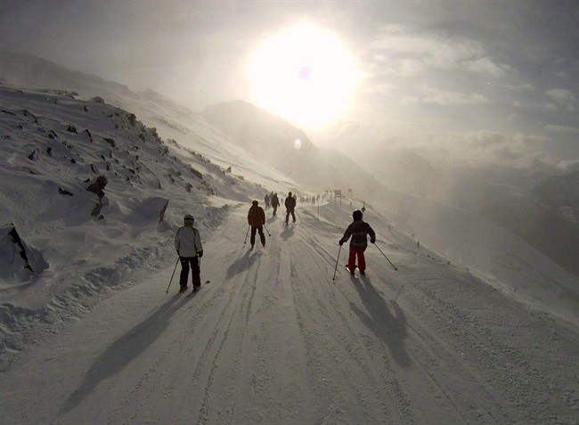 In this Dec 29, 2010 photo, skiers and snowboarders enter the Seventh Heaven run on Blackcomb Mountain in Whistler, B.C. THE CANADIAN PRESS/Jonathan Hayward