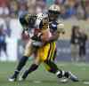 TREVOR HAGAN/WINNIPEG FREE PRESS
Winnipeg Blue Bombers' Clarence Denmark (89) has to tackle Hamilton Tiger-Cats' Mike Daly (35) after he catches an interception during first half  CFL action.