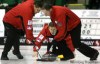 MIKE DEAL / WINNIPEG FREE PRESS
Skip Bob Sigurdson of Granite lines up a rock against the Murray Woodward team from Rorketon in first round at MCA Safeway Curling Championship Wednesday.