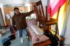 JOE BRYKSA / WINNIPEG FREE PRESS
Roseau River resident Raymond Alexander raises his belongings to protect them from flooding.